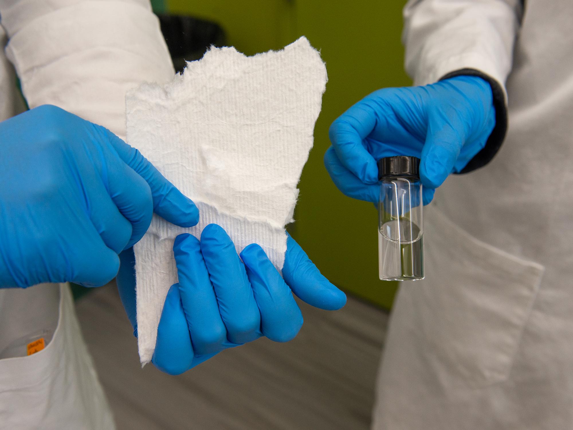 "Amir Sheikhi, Penn State assistant professor of chemical engineering, found a new process to separate and recycle rare earth elements using plant cellulose, an inexpensive renewable resource found in paper, cotton and pulp, like the paper towel shown here. The vial contains the nanoparticles that are used to separate rare earth elements from old computers and circuit boards. Credit: Kate Myers. All Rights Reserved."